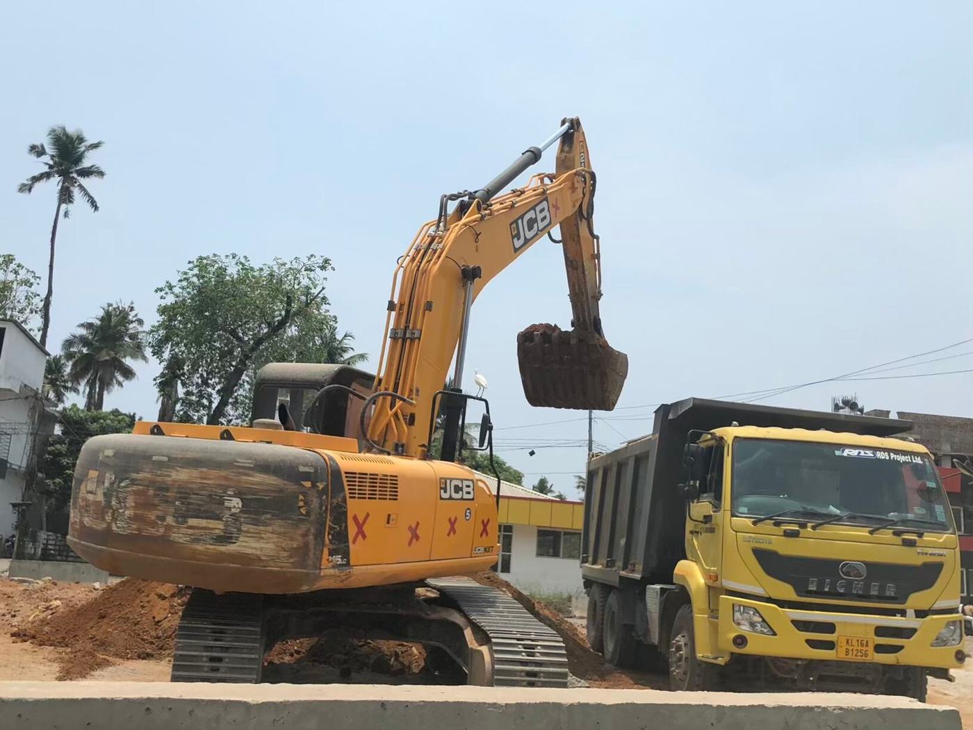 Excavator and tipper truck