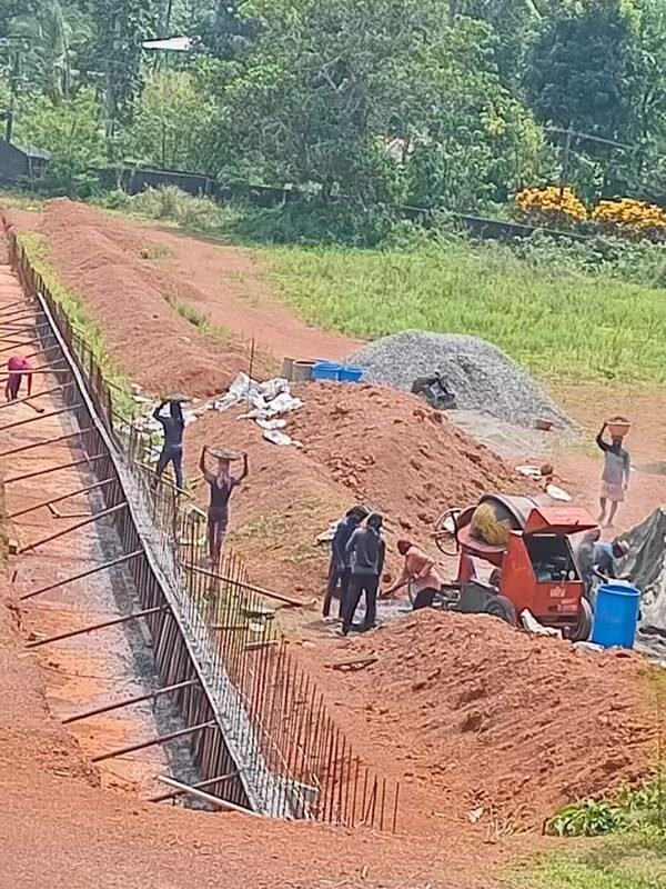 Workers at foundation trench